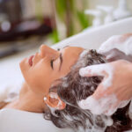 Portrait of women which wash hair in a beauty salon.Hairdresser washing hair.